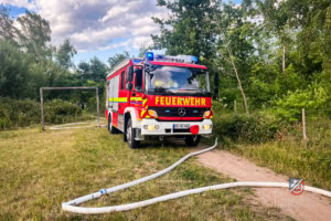 A fire truck is parked on the side of a road.